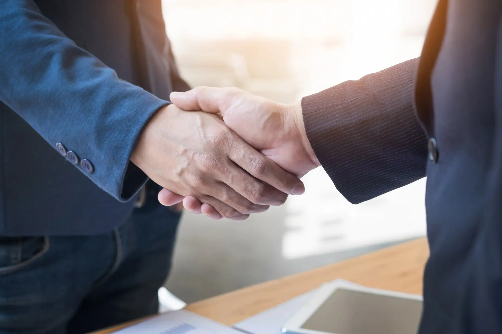 Image of two businesspeople shaking hands